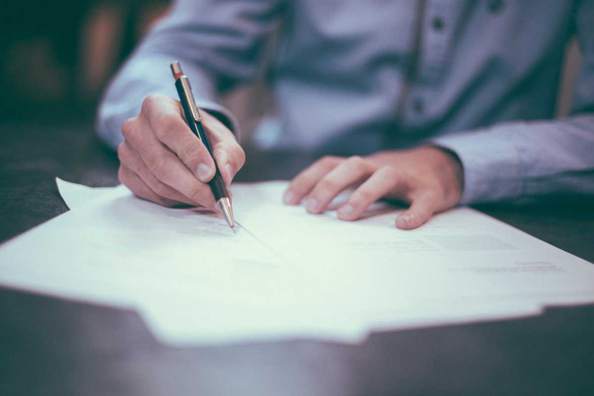 Lawyer filling out paperwork.