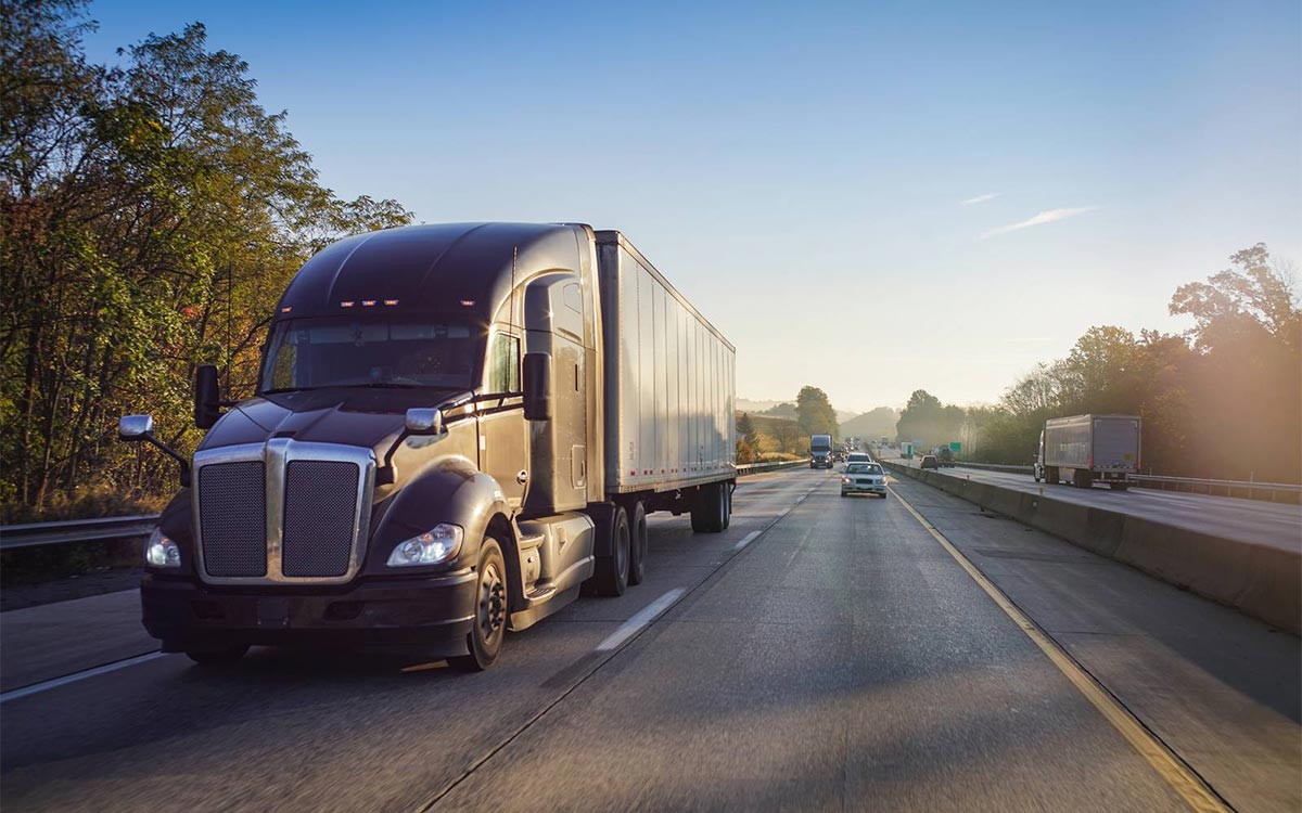 Truck driving in morning traffic